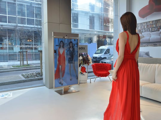 Girl trying red dress
